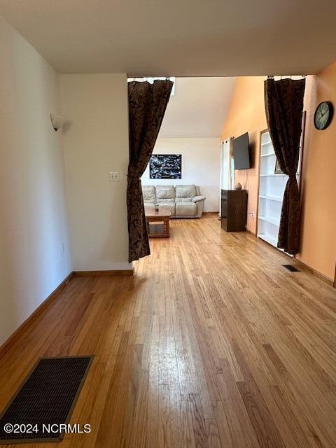 unfurnished living room with light wood-type flooring