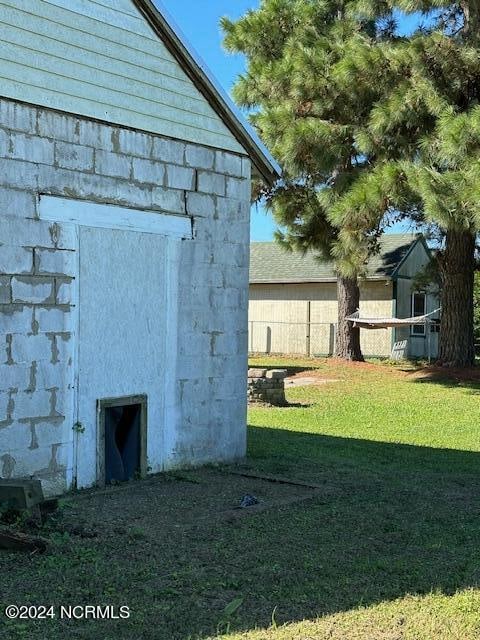 view of home's exterior with a lawn