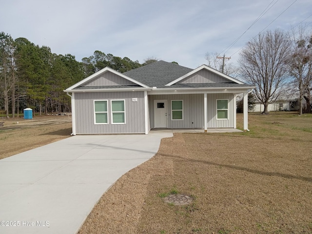 view of front of home with a porch and a front lawn