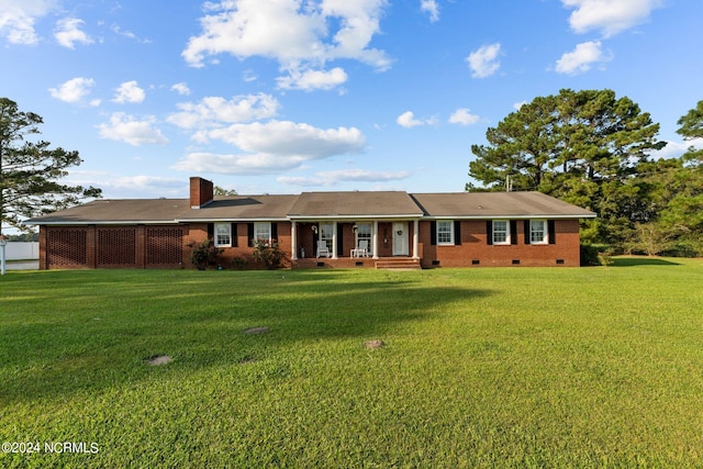 ranch-style house featuring a front yard