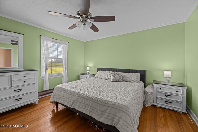 775 Gray Rd, Vanceboro, NC 28586 - bedroom with wood finished floors, crown molding, ceiling fan, and baseboards
