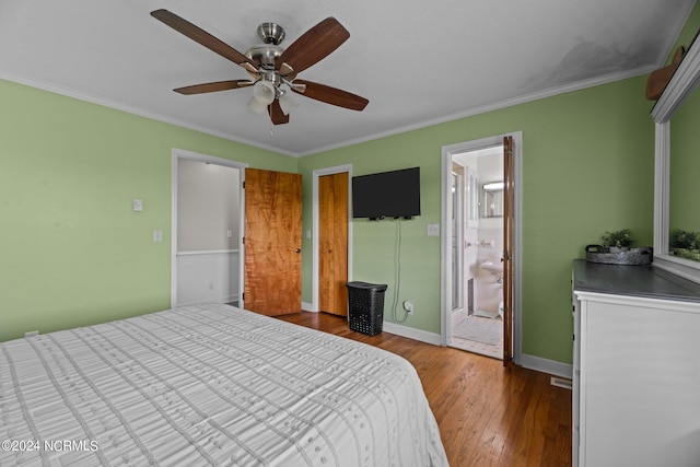 bedroom with ornamental molding, wood-type flooring, ensuite bath, and ceiling fan