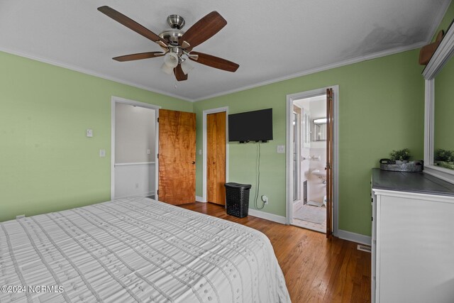 775 Gray Rd, Vanceboro, NC 28586 - bedroom with wood finished floors, crown molding, baseboards, ceiling fan, and connected bathroom