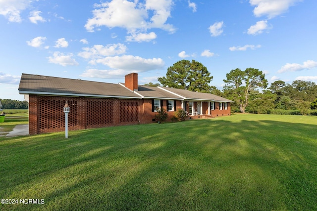 775 Gray Rd, Vanceboro, NC 28586 - rear view of property with a yard, a chimney, and crawl space