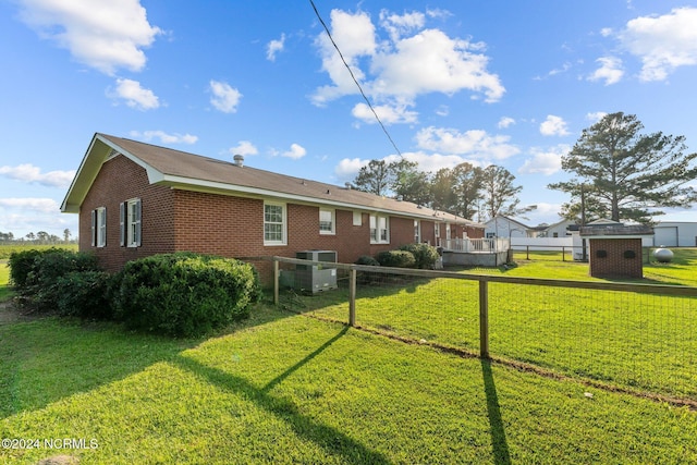 775 Gray Rd, Vanceboro, NC 28586 - rear view of house with brick siding and central AC