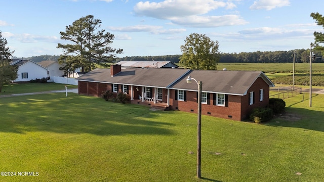 single story home with a front lawn