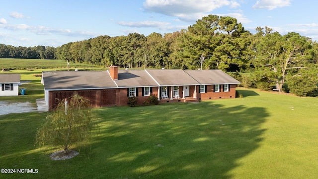 775 Gray Rd, Vanceboro, NC 28586 - ranch-style home featuring a front lawn, a chimney, a view of trees, crawl space, and brick siding