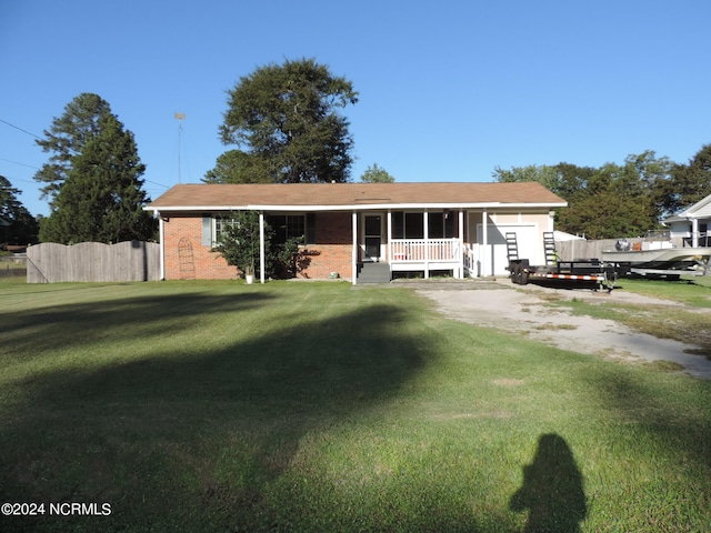 view of front facade with a front yard and a porch