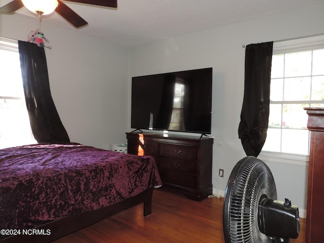 bedroom featuring ceiling fan and hardwood / wood-style flooring