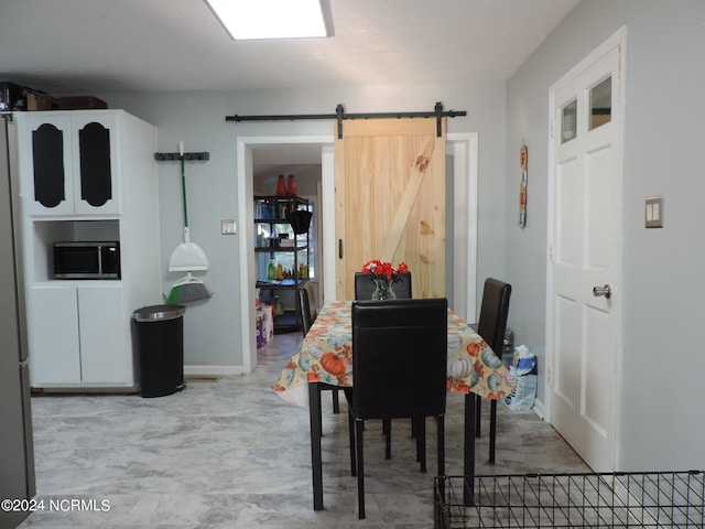 dining space with a barn door