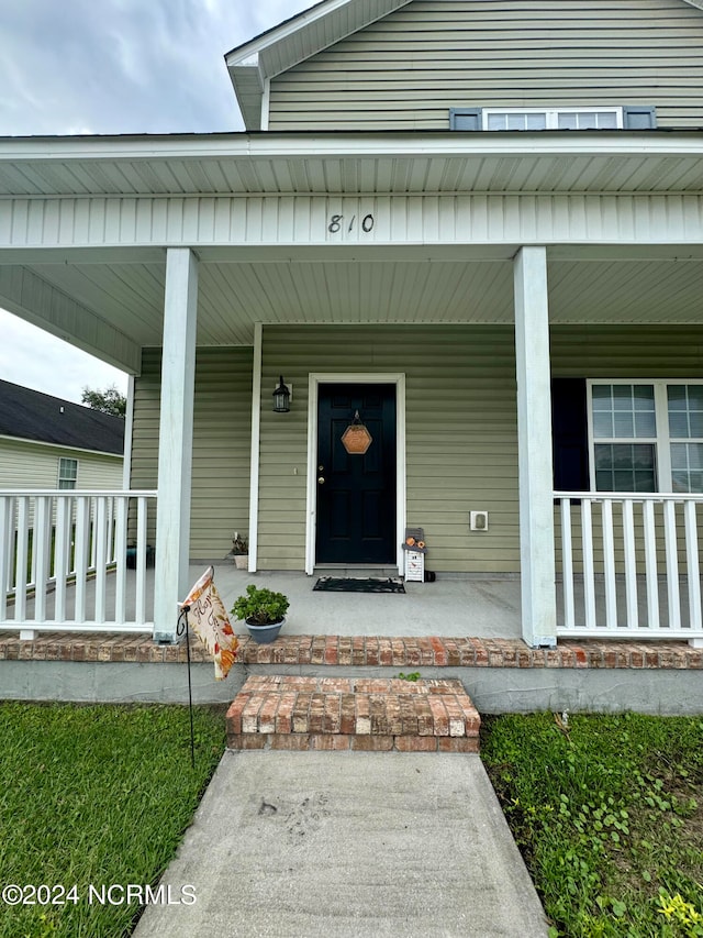 entrance to property with covered porch