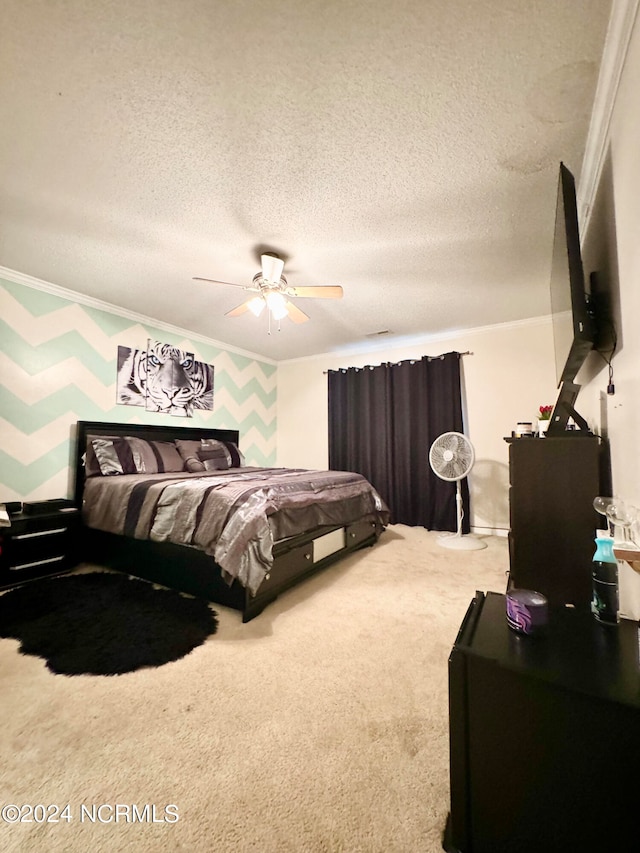 carpeted bedroom with ceiling fan, a textured ceiling, and crown molding