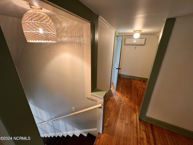 interior space featuring hardwood / wood-style floors and a wall unit AC
