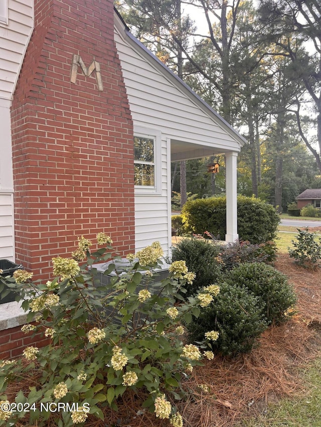 view of side of property with brick siding