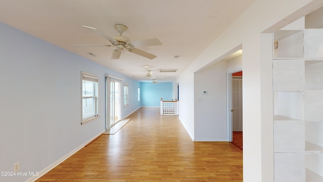 corridor featuring light hardwood / wood-style floors