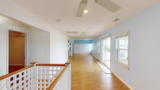 hall with light hardwood / wood-style flooring