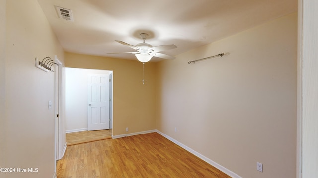 spare room with light hardwood / wood-style floors and ceiling fan