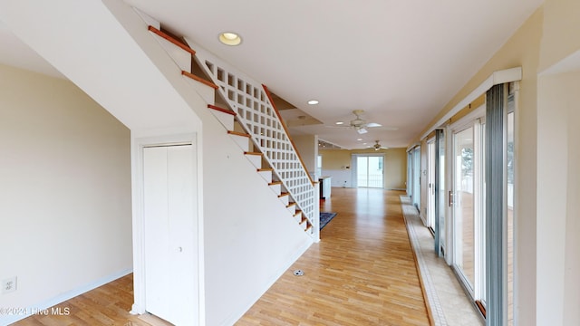 corridor featuring light hardwood / wood-style floors