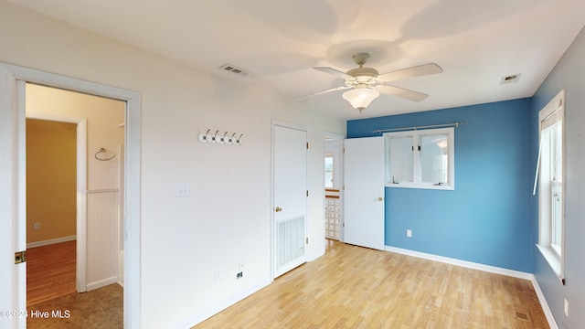 unfurnished bedroom featuring light hardwood / wood-style floors and ceiling fan