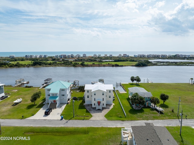 birds eye view of property featuring a water view