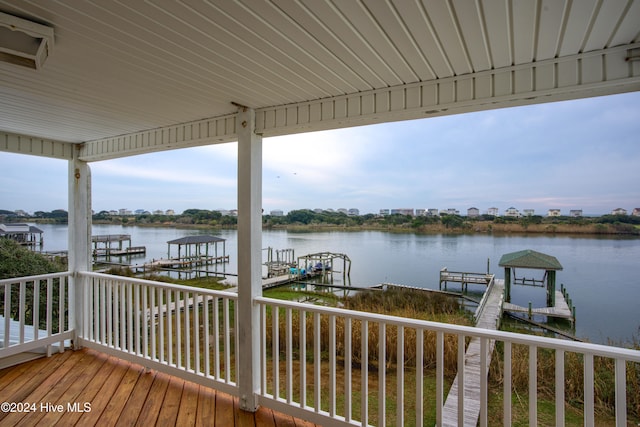 deck featuring a dock and a water view