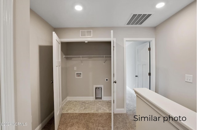 laundry room with washer hookup and light colored carpet