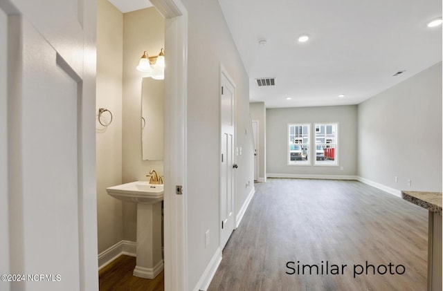 interior space featuring sink and hardwood / wood-style flooring