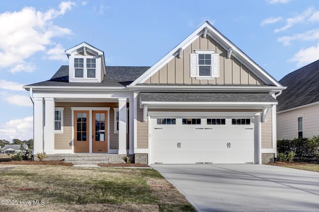 view of front of house featuring covered porch and a garage