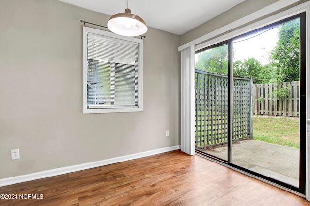 unfurnished room featuring hardwood / wood-style floors