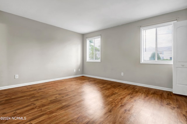 empty room with wood-type flooring