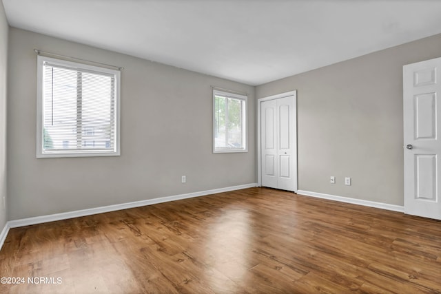 spare room featuring hardwood / wood-style flooring