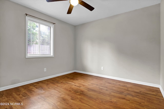 unfurnished room with ceiling fan and hardwood / wood-style flooring