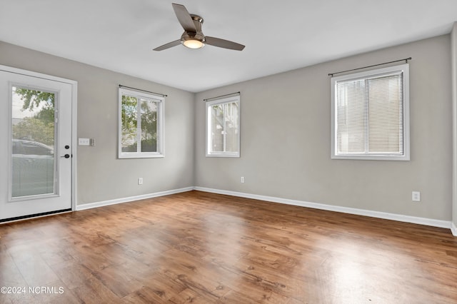 spare room featuring ceiling fan and hardwood / wood-style flooring