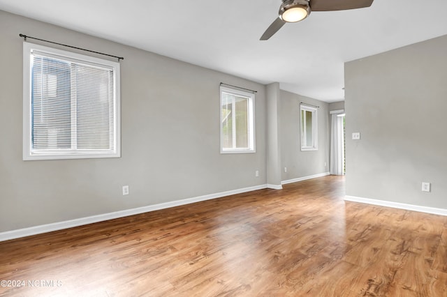 spare room featuring ceiling fan and light hardwood / wood-style flooring