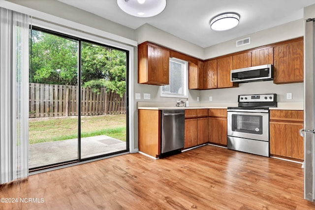 kitchen featuring light hardwood / wood-style flooring, appliances with stainless steel finishes, and sink