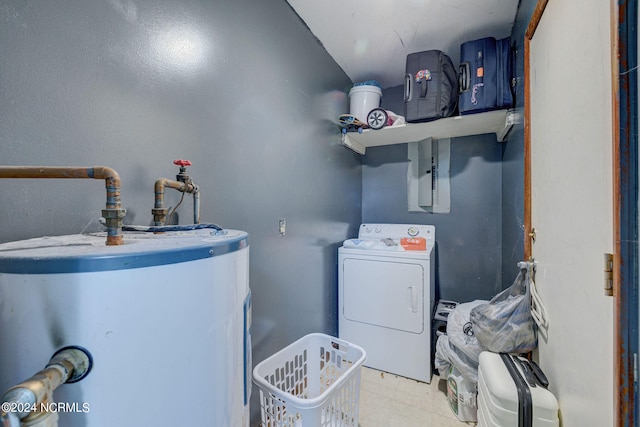 laundry area with gas water heater and washer / dryer