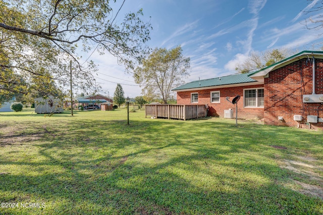 view of yard featuring a wooden deck