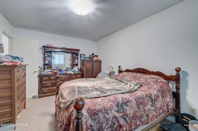 carpeted bedroom with a textured ceiling