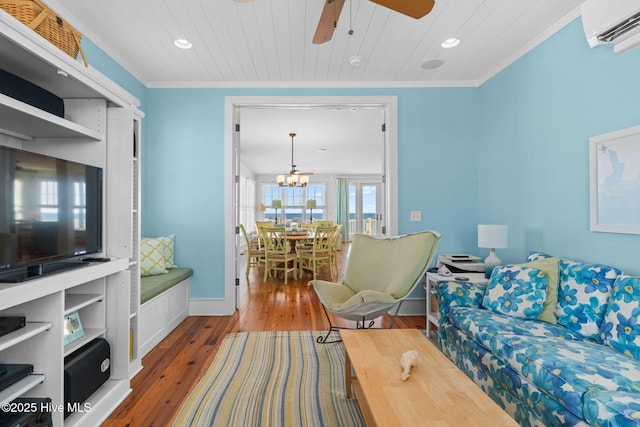 6615 W Beach Dr, Oak Island, NC 28465 - living area featuring a wall mounted air conditioner, ceiling fan, recessed lighting, wood-type flooring, and crown molding