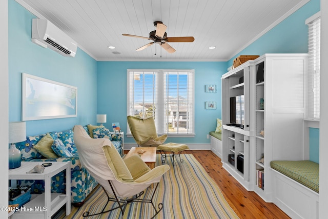 6615 W Beach Dr, Oak Island, NC 28465 - sitting room featuring a wall mounted air conditioner, light wood finished floors, ceiling fan, wood ceiling, and ornamental molding