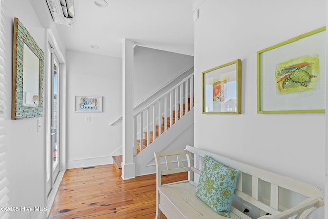 6615 W Beach Dr, Oak Island, NC 28465 - foyer entrance featuring stairs and wood finished floors