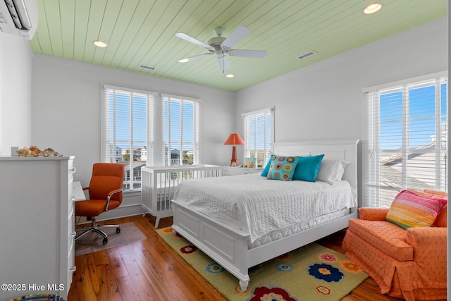 6615 W Beach Dr, Oak Island, NC 28465 - bedroom featuring light wood finished floors, wood ceiling, recessed lighting, ornamental molding, and ceiling fan