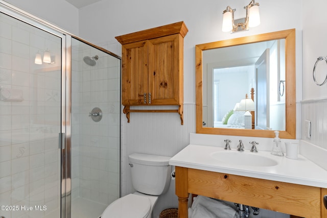 6615 W Beach Dr, Oak Island, NC 28465 - full bathroom with toilet, a shower stall, and vanity