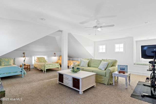 6615 W Beach Dr, Oak Island, NC 28465 - carpeted living area with a ceiling fan and lofted ceiling