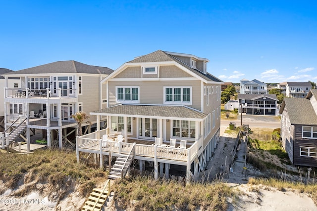 6615 W Beach Dr, Oak Island, NC 28465 - rear view of house with stairs, roof with shingles, and french doors