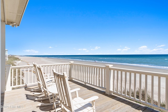 6615 W Beach Dr, Oak Island, NC 28465 - wooden deck with view of water and beach