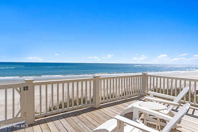 6615 W Beach Dr, Oak Island, NC 28465 - wooden terrace featuring view of water and beach