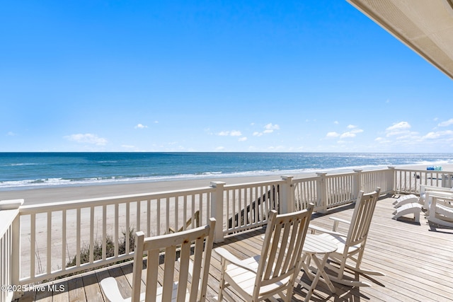 6615 W Beach Dr, Oak Island, NC 28465 - surrounding community featuring a beach view and a deck with water view