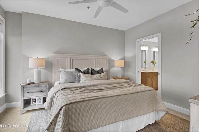 14 Grace St Unit 1111, Wilmington, NC 28401 - bedroom featuring ceiling fan, ensuite bathroom, baseboards, and light colored carpet
