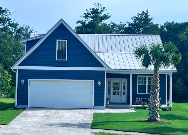 view of front facade with a garage and a front yard